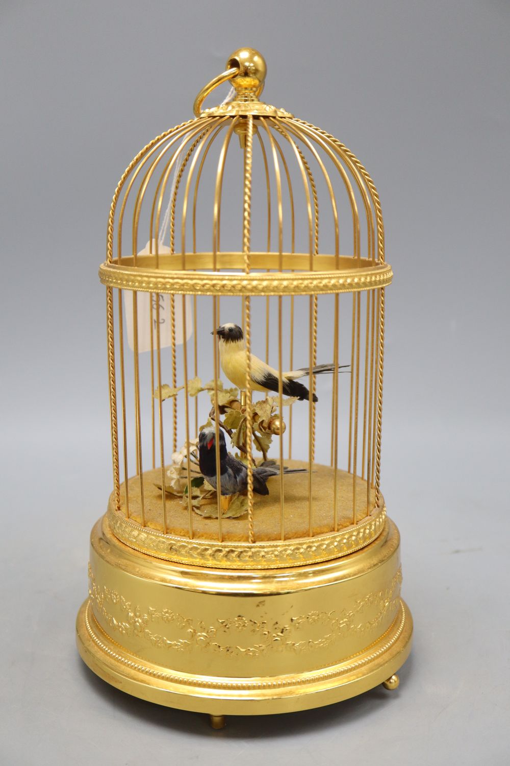A two bird automaton in gilt metal cage, height 28cm